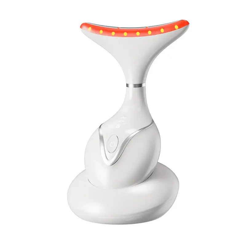 EMS mikroproudový beauty přístroj na obličej v elegantním bílém provedení s červenými LED světly.